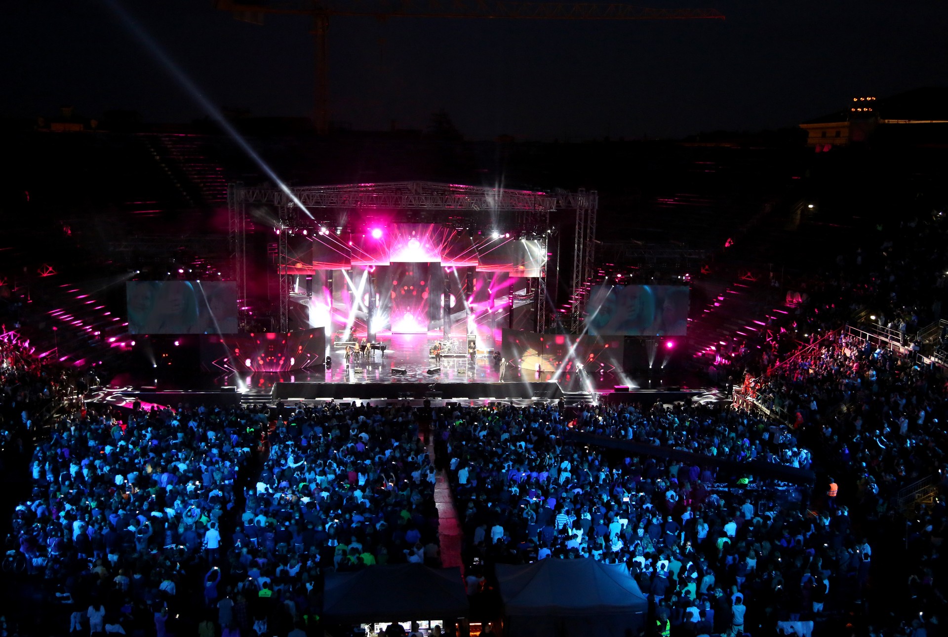 Live concert inside the Arena with people and stage